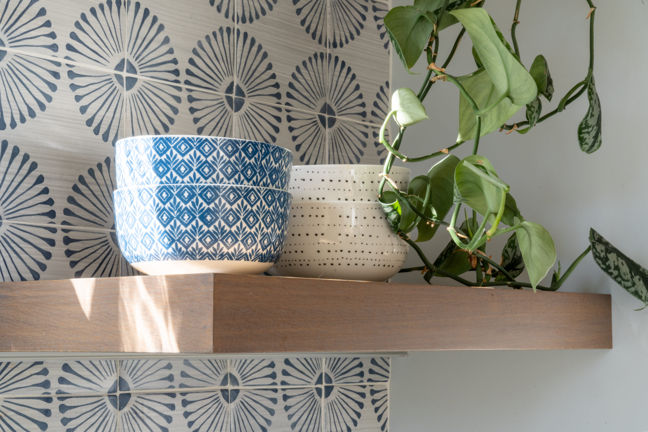 Decorative handmade terracotta wall tile with artisan pattern and natural texture in a contemporary interior.