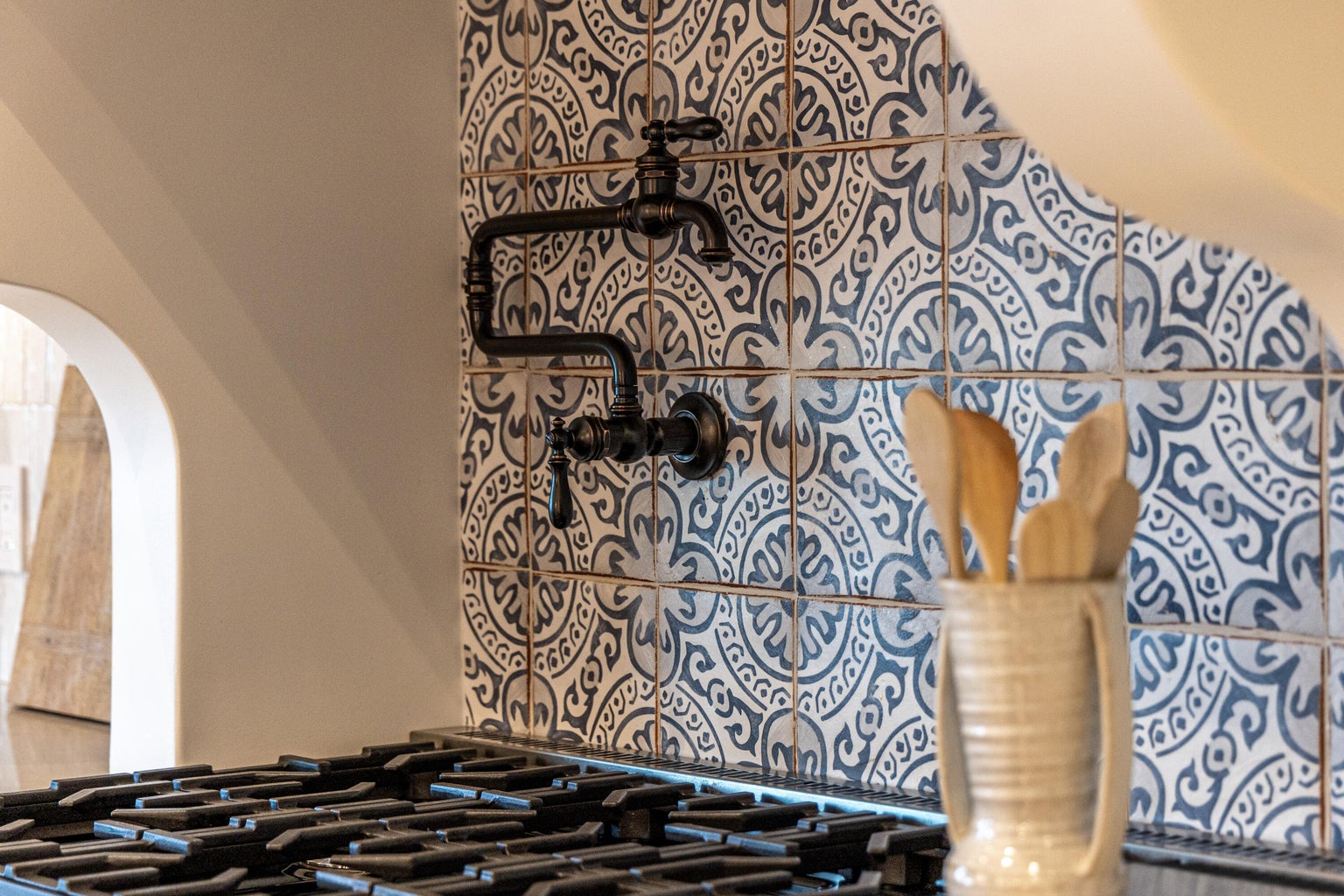 Handmade terracotta wall tile adding warmth, texture, and artisan character to a contemporary kitchen.